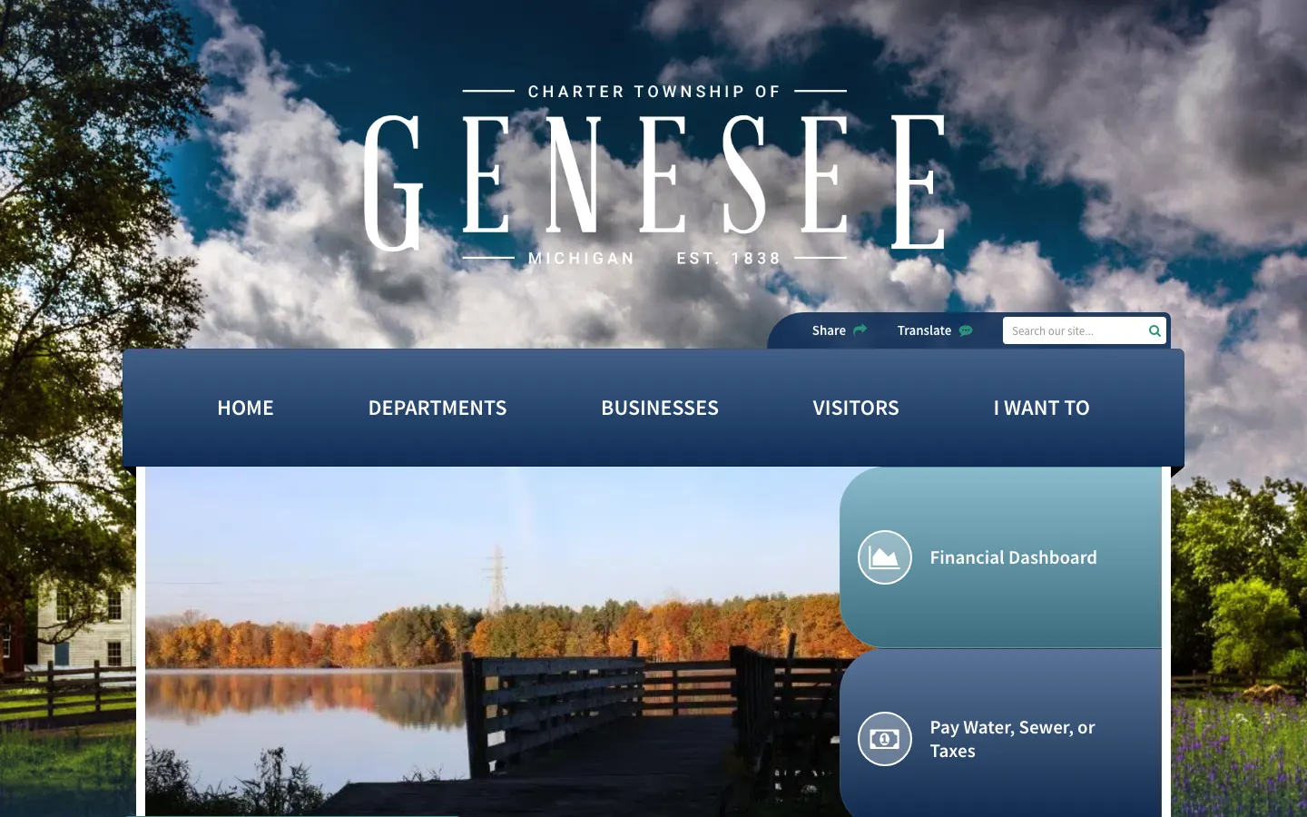 Genesee Township website home page on a desktop screen: the Charter Township of Genesee wordmark over a sky photo, a main menu with Departments, Businesses, Visitors and I Want To, a lake photo, and quick links for the Financial Dashboard and paying water, sewer or taxes.