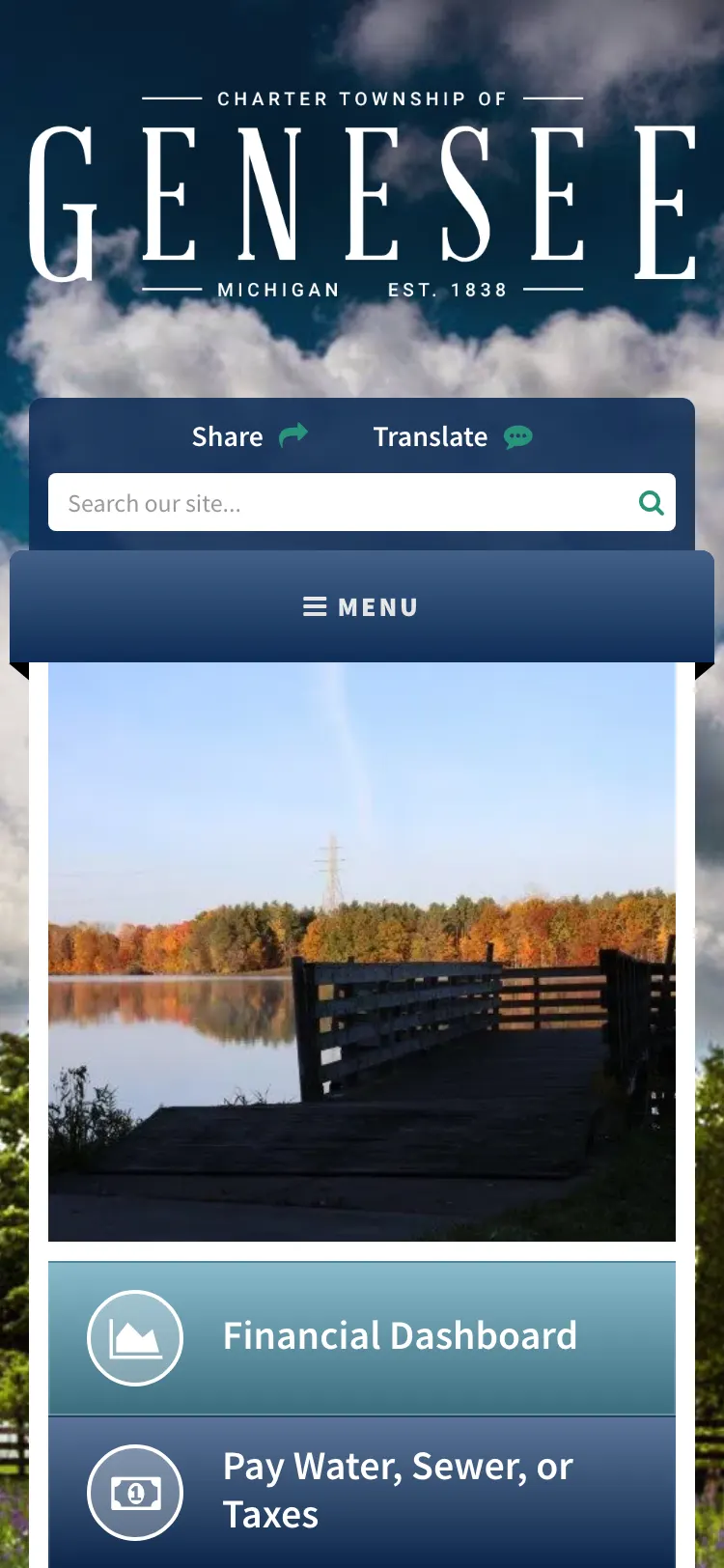Genesee Township website home page on a phone: the township wordmark, Share and Translate buttons, a site search box, a Menu button and the Financial Dashboard link.